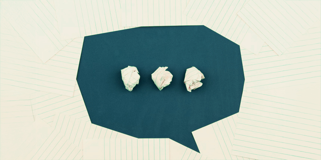 Paper scrunched up into the shape of a speech bubble